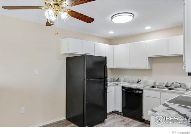 kitchen featuring black appliances, white cabinetry, light wood-type flooring, sink, and ceiling fan