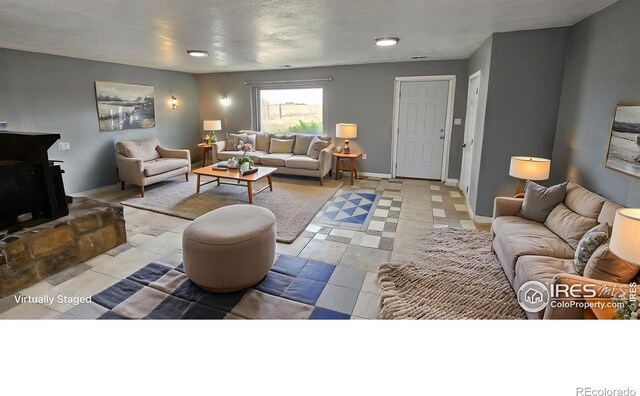 18542 County Road 8, Wiggins, CO 80654 - living room featuring baseboards