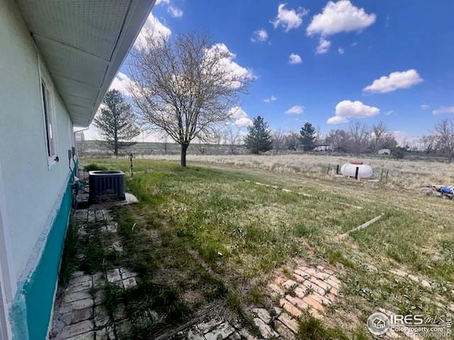 18542 County Road 8, Wiggins, CO 80654 - view of yard featuring cooling unit and a rural view