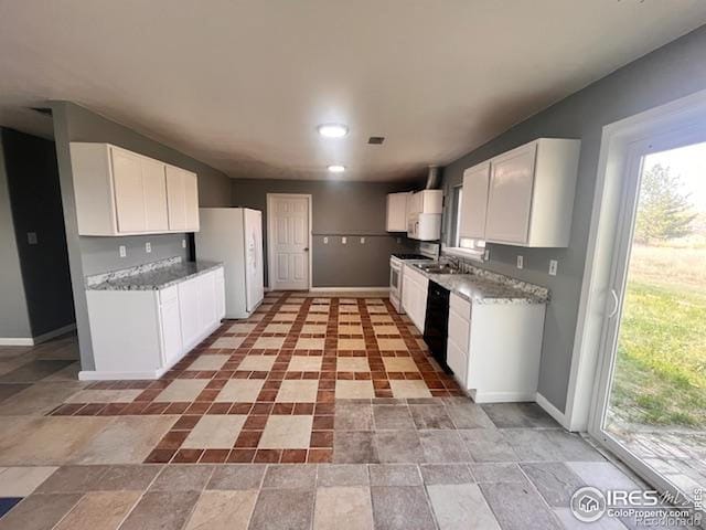 18542 County Road 8, Wiggins, CO 80654 - kitchen featuring white appliances, baseboards, white cabinetry, and healthy amount of natural light