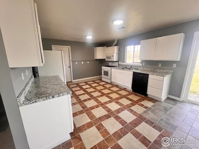 18542 County Road 8, Wiggins, CO 80654 - kitchen featuring white appliances, white cabinets, and healthy amount of natural light
