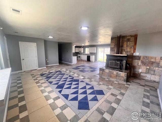 18542 County Road 8, Wiggins, CO 80654 - unfurnished living room with recessed lighting and baseboards