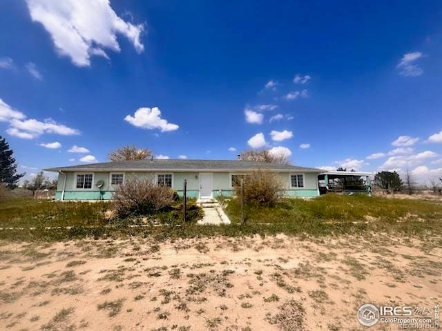 18542 County Road 8, Wiggins, CO 80654 - ranch-style house with a carport