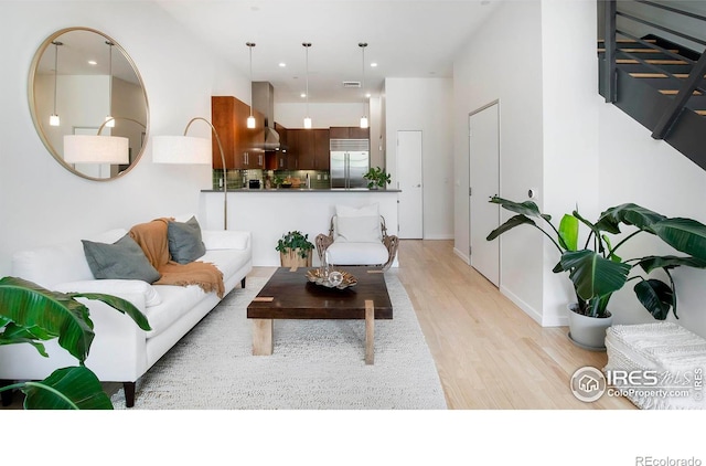 living room with light hardwood / wood-style floors