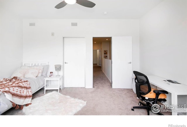 bedroom with ceiling fan and light colored carpet