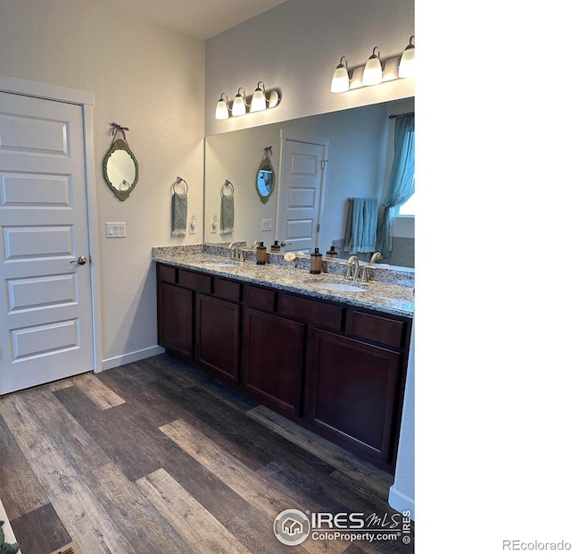 bathroom with vanity and hardwood / wood-style floors