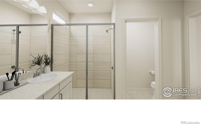 bathroom with a shower with door, vanity, and toilet