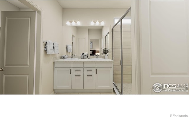 bathroom with walk in shower and vanity