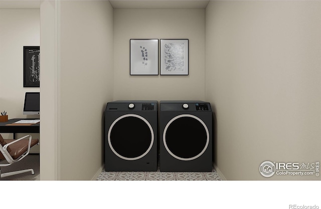 laundry room with washing machine and clothes dryer