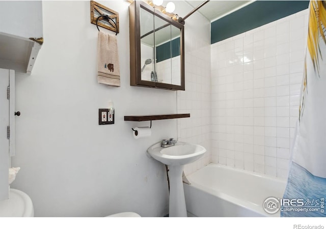 bathroom with toilet and shower / bathtub combination with curtain