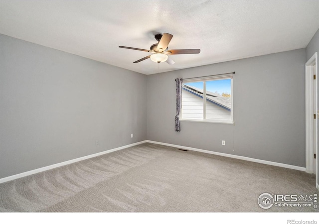 unfurnished room featuring carpet floors and ceiling fan