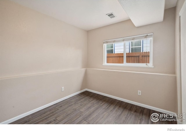 empty room with wood-type flooring