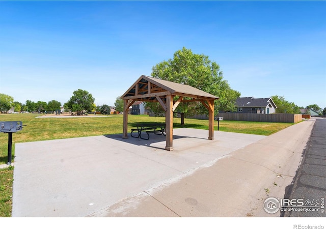 surrounding community featuring a lawn and a gazebo