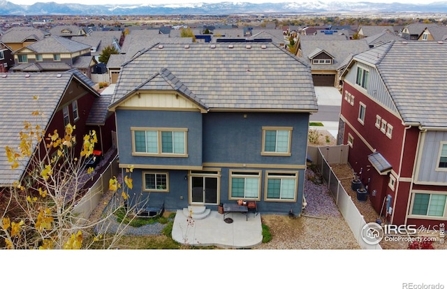 view of front of home featuring a mountain view and a patio