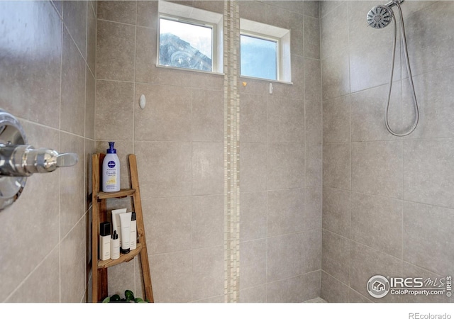 bathroom with tiled shower