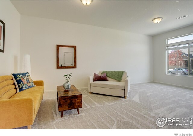 185 Pipit Lake Way, Erie, CO 80516 - living area featuring light carpet and baseboards