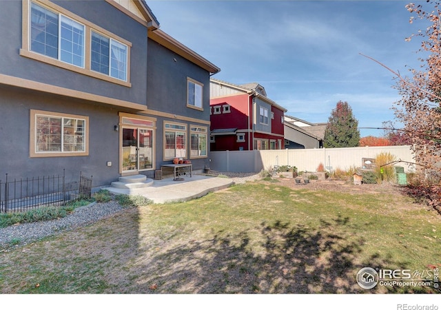 exterior space featuring a patio and a yard