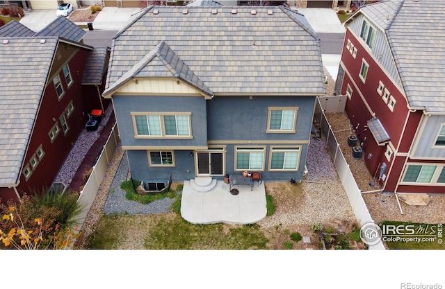 exterior space with central AC unit and a patio area