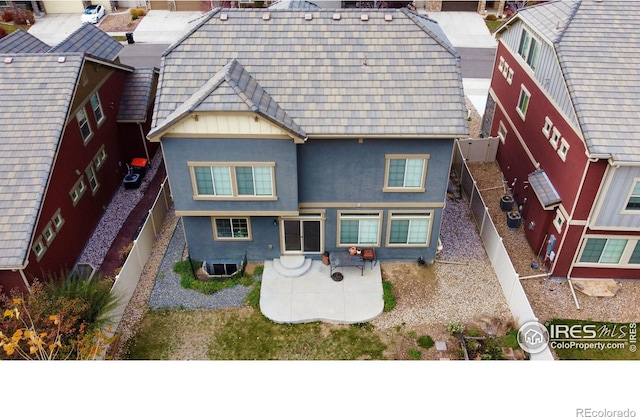 185 Pipit Lake Way, Erie, CO 80516 - rear view of property with stucco siding, a patio area, a fenced backyard, and central AC unit
