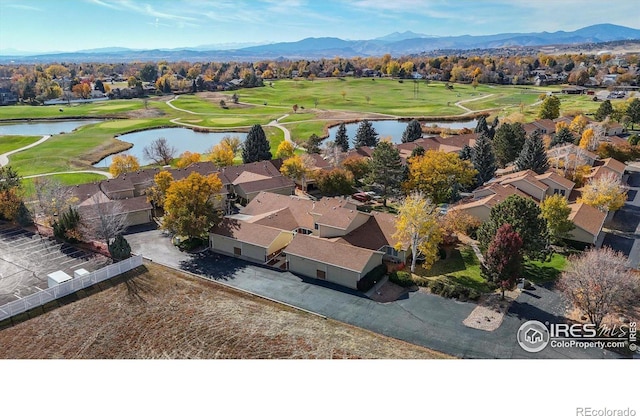 aerial view featuring a water and mountain view