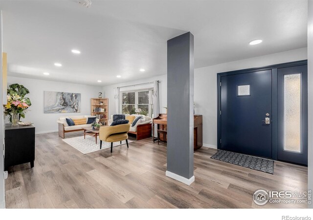 entryway with light hardwood / wood-style flooring