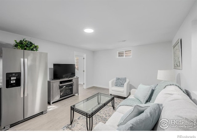 living room with light hardwood / wood-style floors