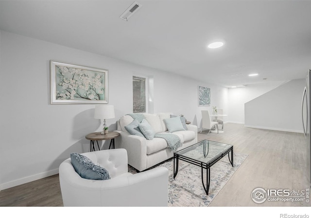 living room with wood-type flooring