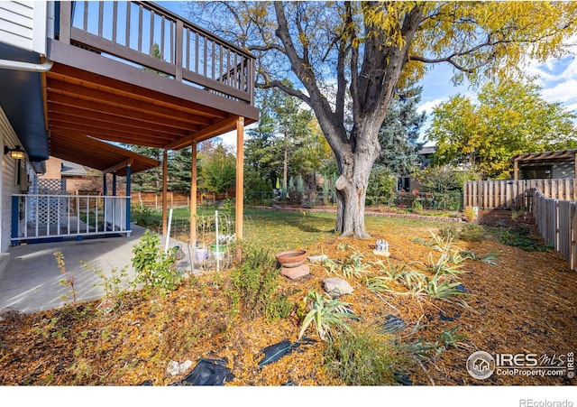 view of yard featuring a wooden deck