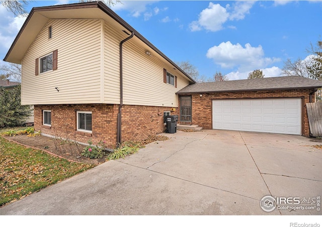 view of side of home with a garage