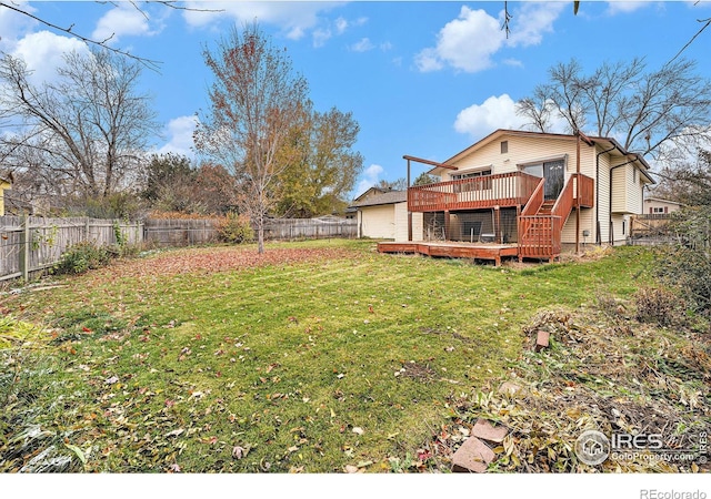 view of yard featuring a wooden deck