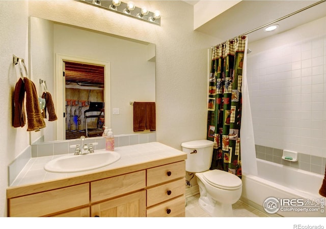 full bathroom featuring toilet, vanity, tile patterned flooring, and shower / bathtub combination with curtain