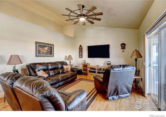 living room featuring ceiling fan and light hardwood / wood-style flooring