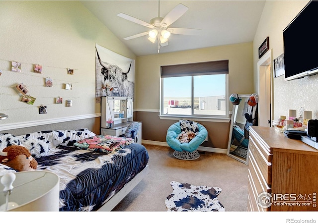 bedroom with vaulted ceiling, light carpet, and ceiling fan