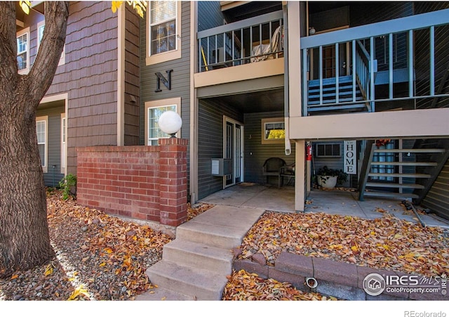 entrance to property with a patio