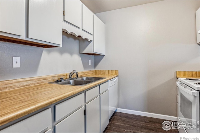 kitchen featuring dark hardwood / wood-style flooring, white cabinetry, white appliances, and sink