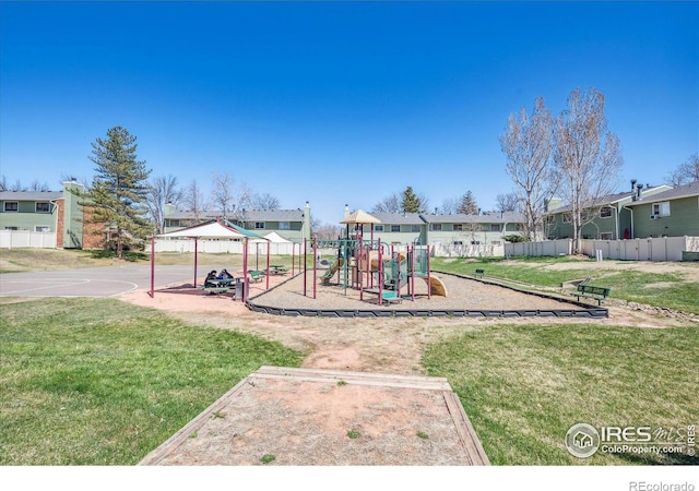 view of jungle gym featuring a lawn