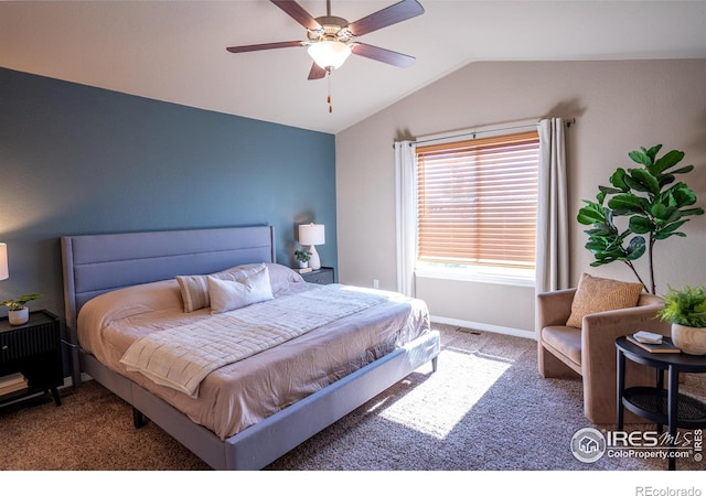 carpeted bedroom featuring ceiling fan and vaulted ceiling