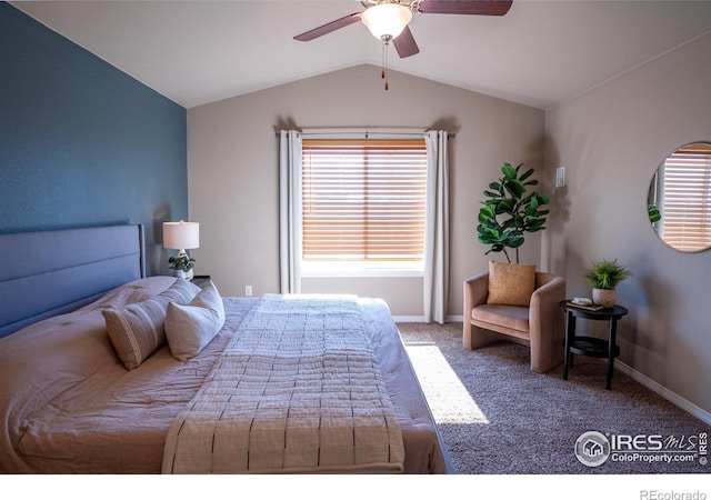 bedroom with vaulted ceiling, ceiling fan, and carpet floors