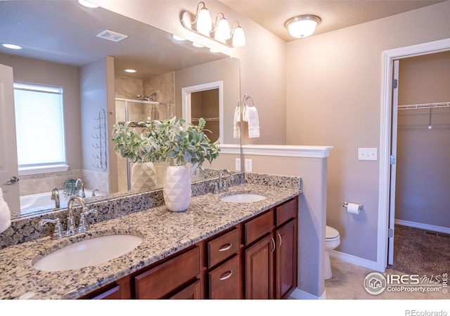 full bathroom with vanity, toilet, and independent shower and bath