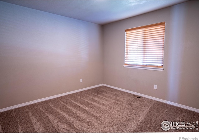 view of carpeted spare room