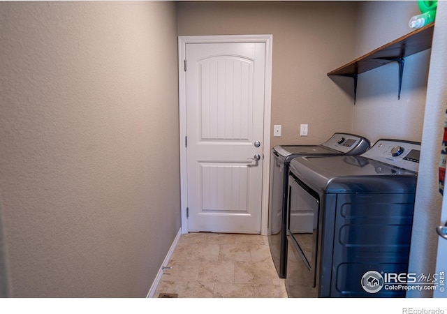 laundry area with washer and dryer