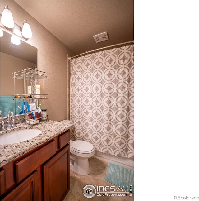 bathroom with vanity, a textured ceiling, toilet, and a shower with curtain