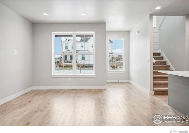 unfurnished dining area featuring light hardwood / wood-style flooring