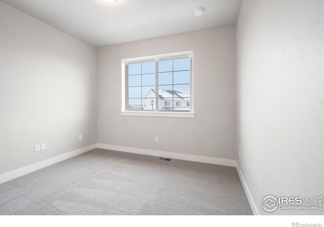 empty room featuring carpet floors