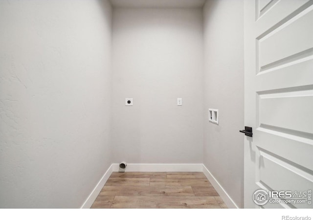 washroom featuring washer hookup, hookup for an electric dryer, and light hardwood / wood-style flooring