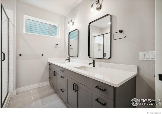 bathroom featuring walk in shower and vanity