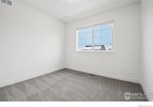 unfurnished room featuring carpet floors