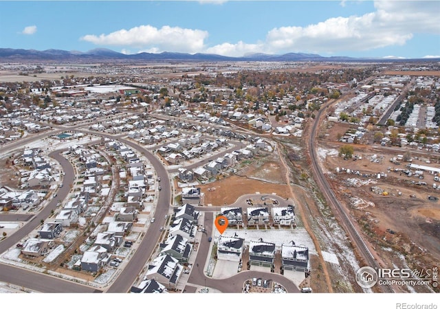 birds eye view of property featuring a mountain view