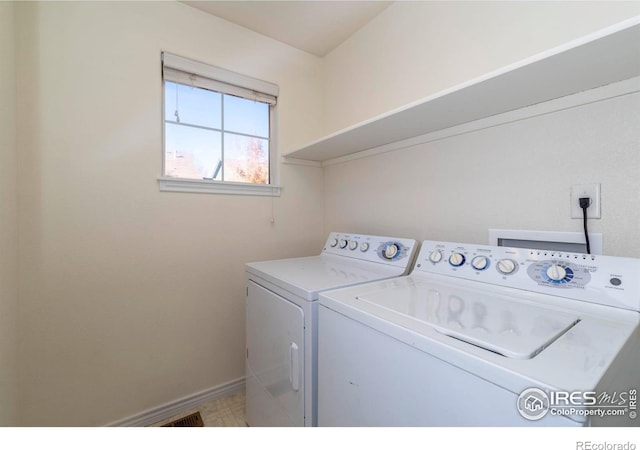818 S Terry St Unit 85, Longmont, CO 80501 - laundry room featuring washing machine and dryer and baseboards