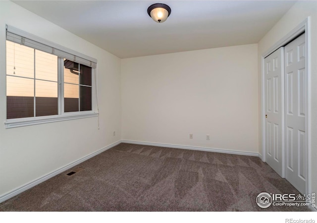 818 S Terry St Unit 85, Longmont, CO 80501 - unfurnished bedroom featuring carpet, baseboards, and a closet